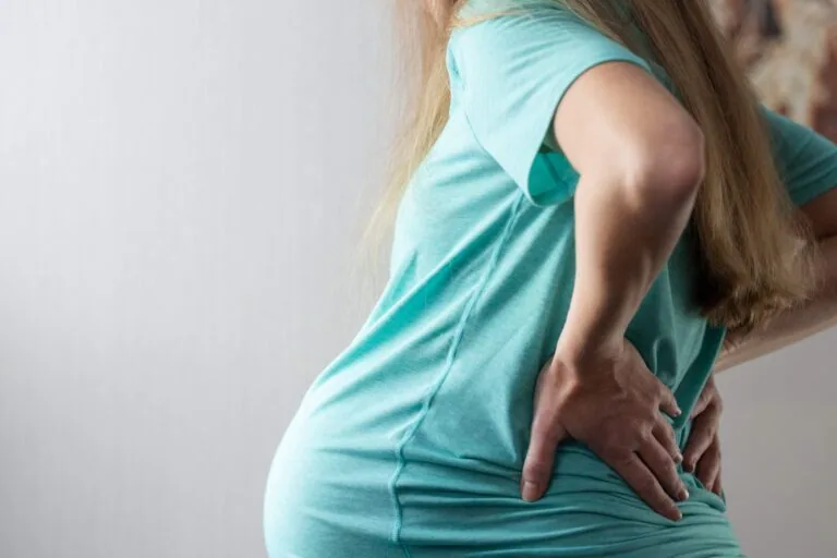 Why Your Back Hurts More as Your Belly Grows